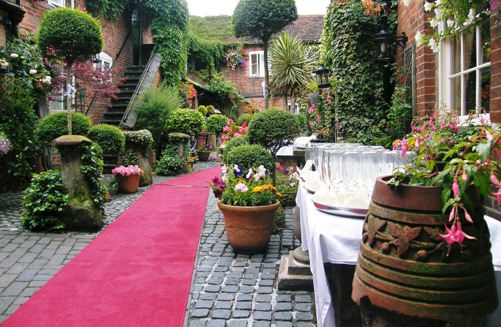 Red carpet courtyard wedding, The Greyhound Coaching Inn
