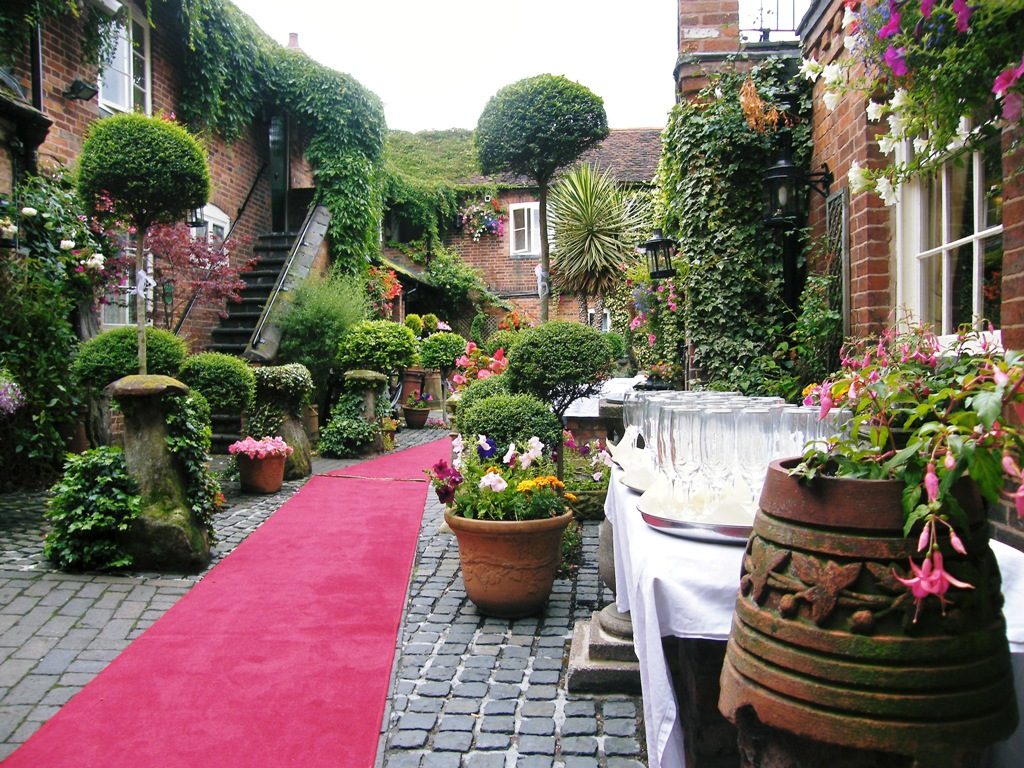 Red carpet courtyard wedding, The Greyhound Coaching Inn