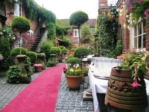 Red carpet courtyard wedding, The Greyhound Coaching Inn