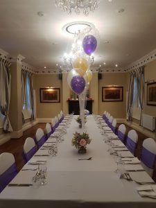 Purple and gold themed small wedding reception meal Christina Room Greyhound Coaching Inn Lutterworth